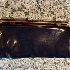 Vintage navy blue vinyl clutch with gold clasp and GORGEOUS lining!